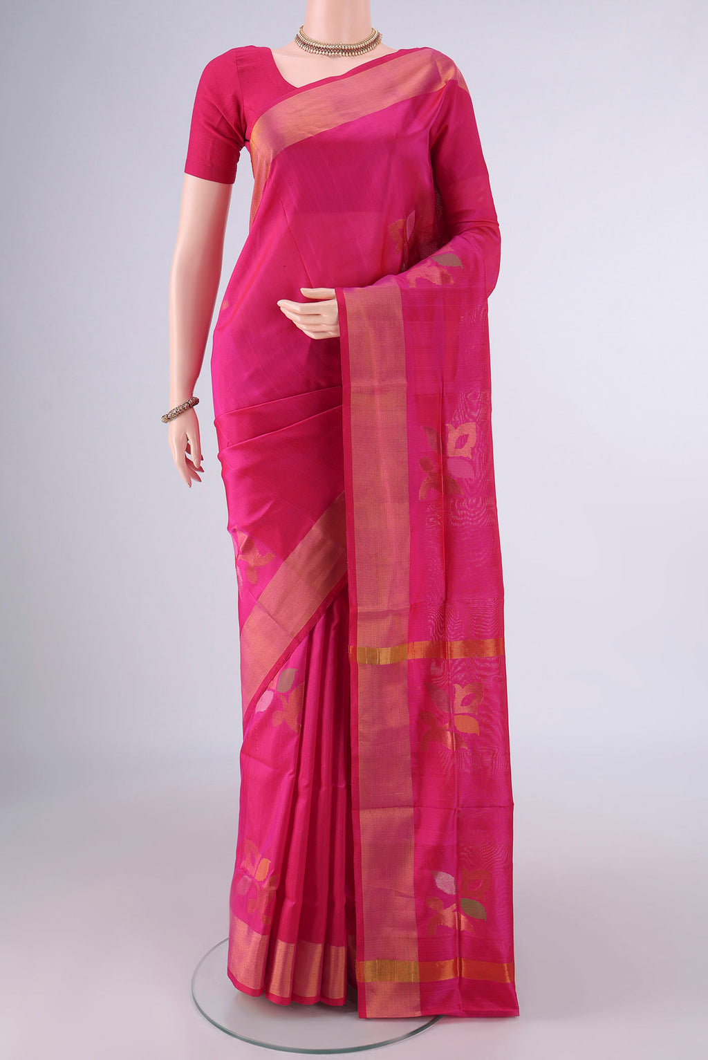 Pure Silk Pink Uppada Saree with Zari And Thread Butta on the body and Zari Border.  displayed on a mannequin