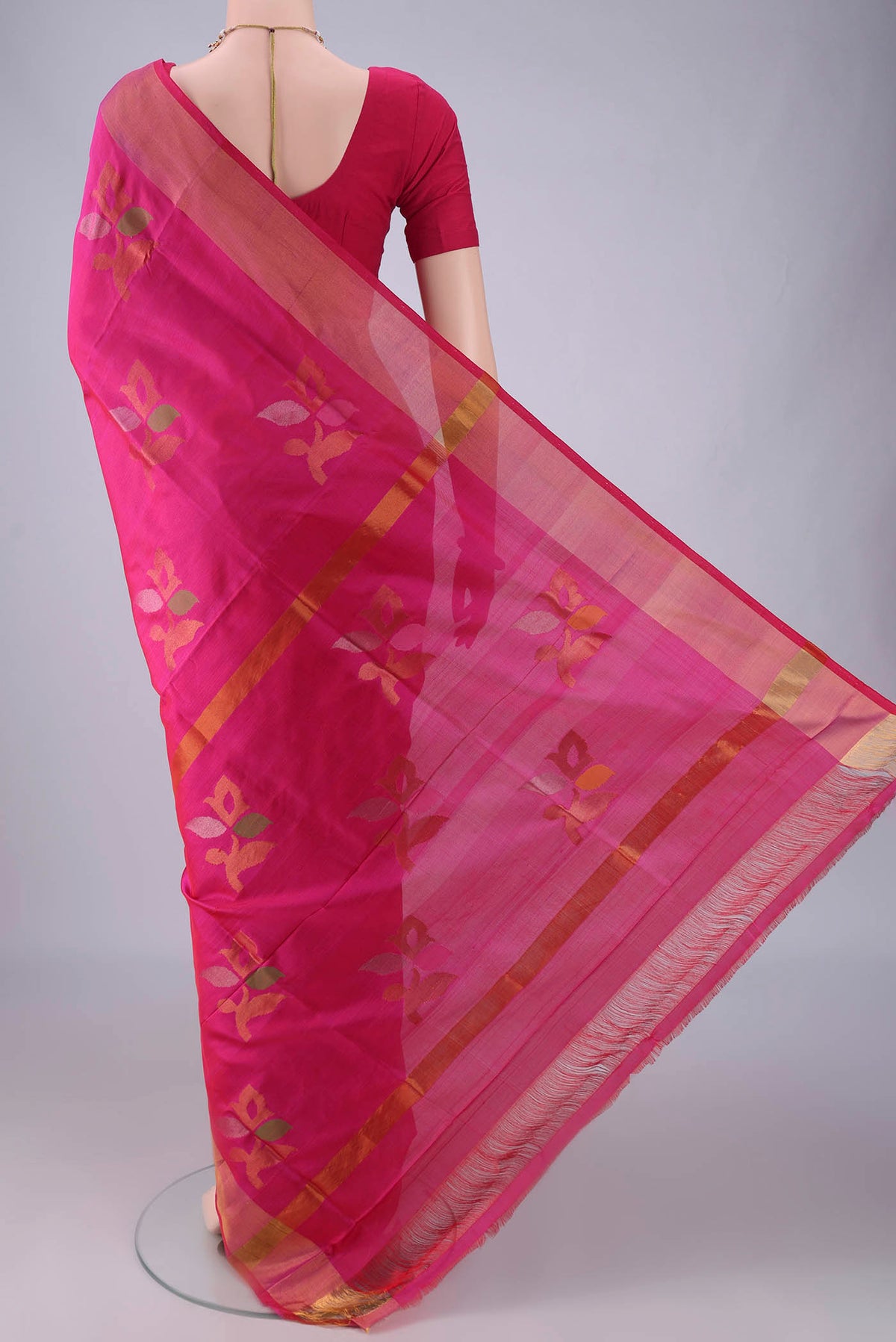Flat view of Pure Silk Pink Uppada Saree with Zari And Thread Butta on the body and Zari Border. 