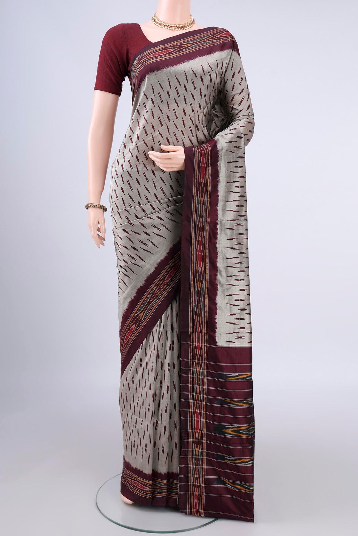 Pure Silk Grey Pochampally Saree with Ikat design on the body and Ikat Border.  displayed on a mannequin