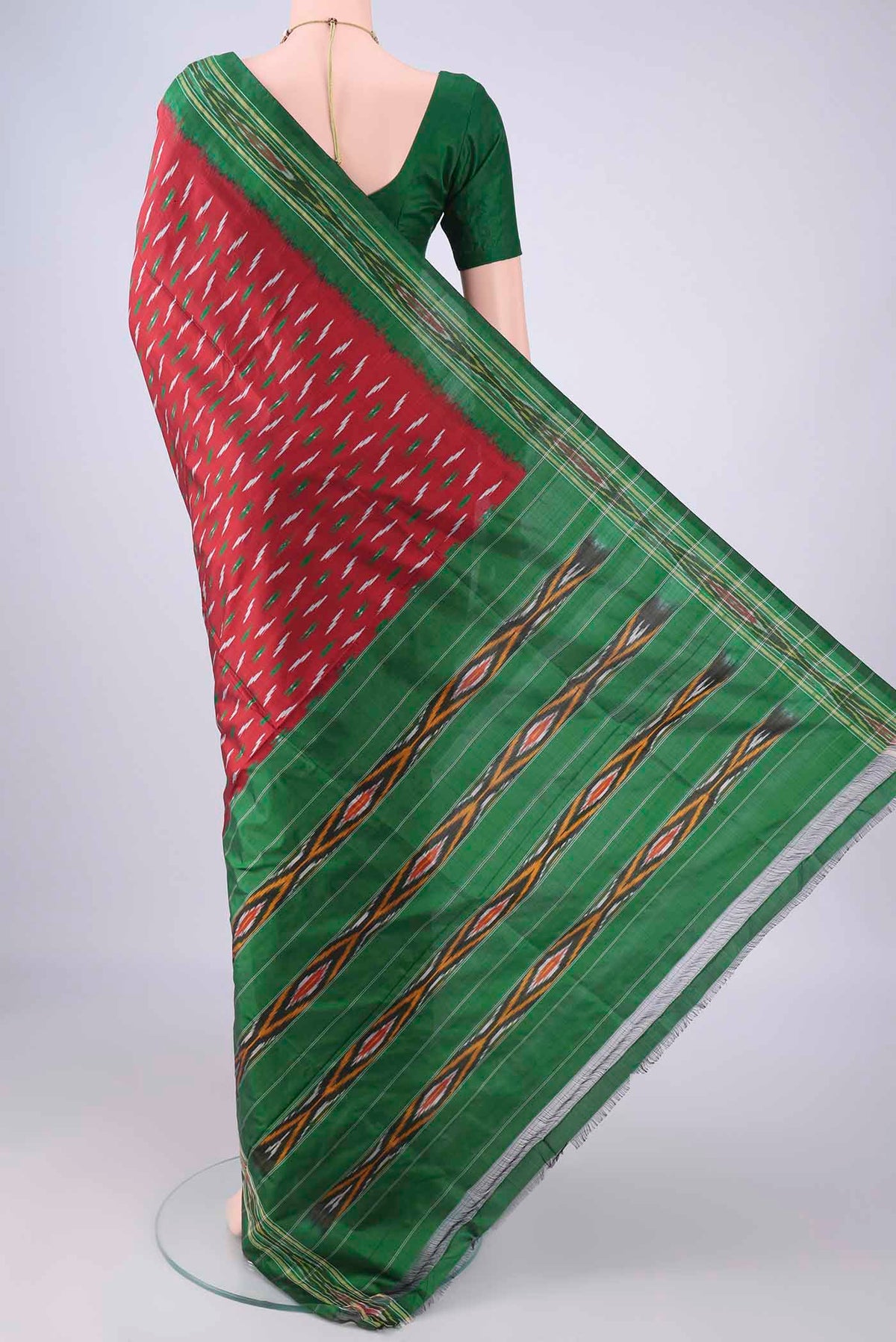 Flat view of Maroon Pochampally Silk Saree with Pure Ikat on the body and Ikat Border. 