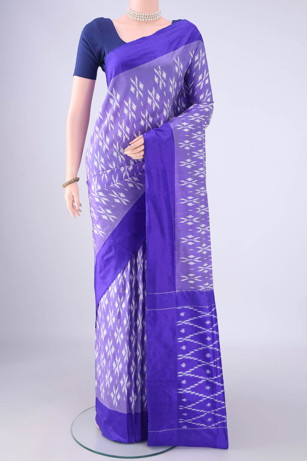 Purple Pochampally Silk Saree with Pure Ikat on the body and Plain Border.  displayed on a mannequin