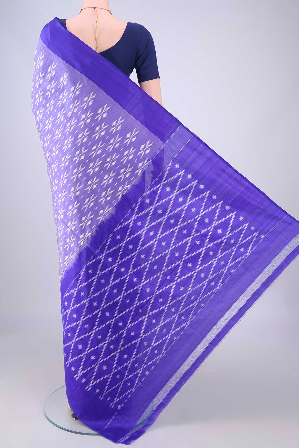 Flat view of Purple Pochampally Silk Saree with Pure Ikat on the body and Plain Border. 
