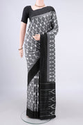 Pure Silk Grey Pochampally Saree with Ikat design on the body and Ikat Border.  displayed on a mannequin