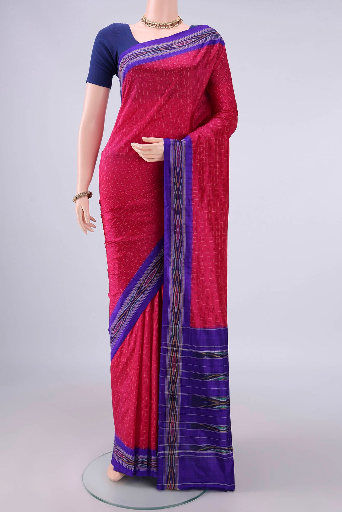 Pure Silk Rani Pink Pochampally Saree with Pure Ikat on the body and Zari Border.  displayed on a mannequin