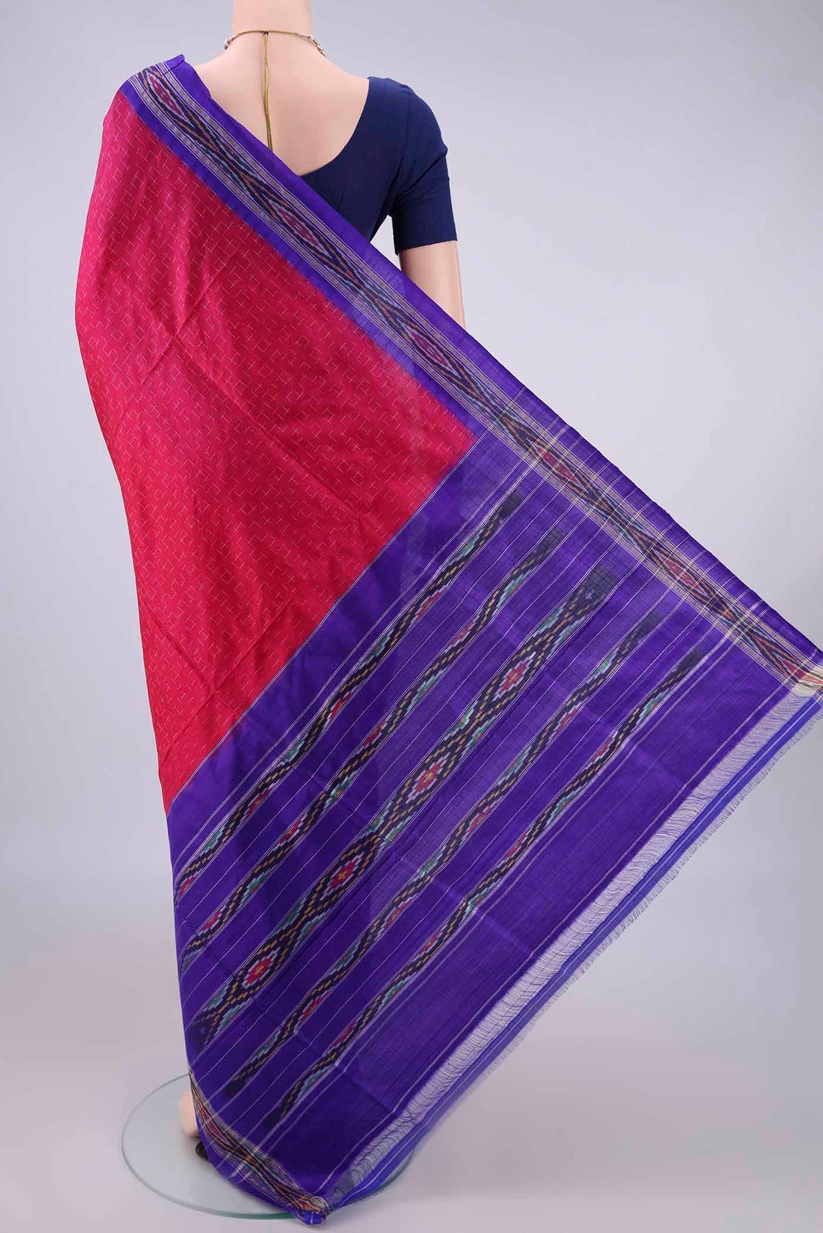 Flat view of Pure Silk Rani Pink Pochampally Saree with Pure Ikat on the body and Zari Border. 