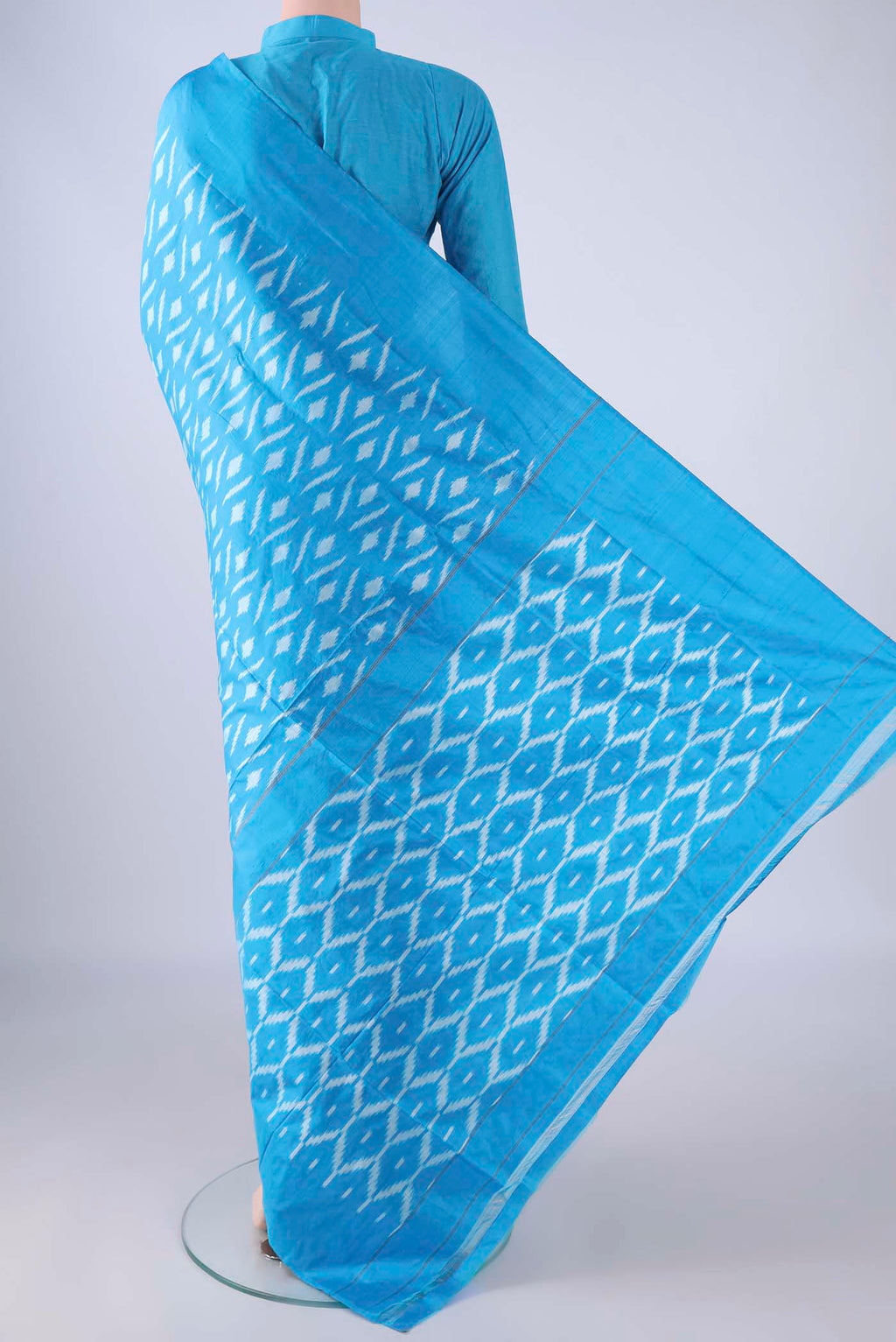 Flat view of Sky Blue Pochampally Silk Saree with Pure Ikat on the body and Plain Border. 