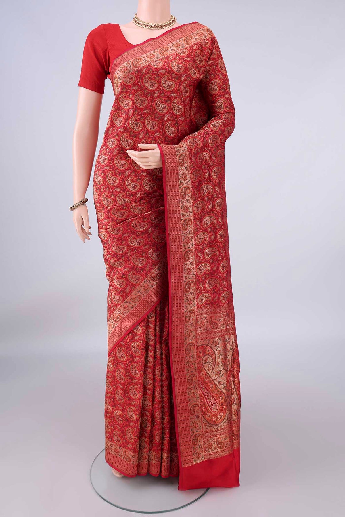Pure Silk Red Banarasi Tanchoi Saree with Jacquard With Zari Butta on the body and Zari Border.  displayed on a mannequin
