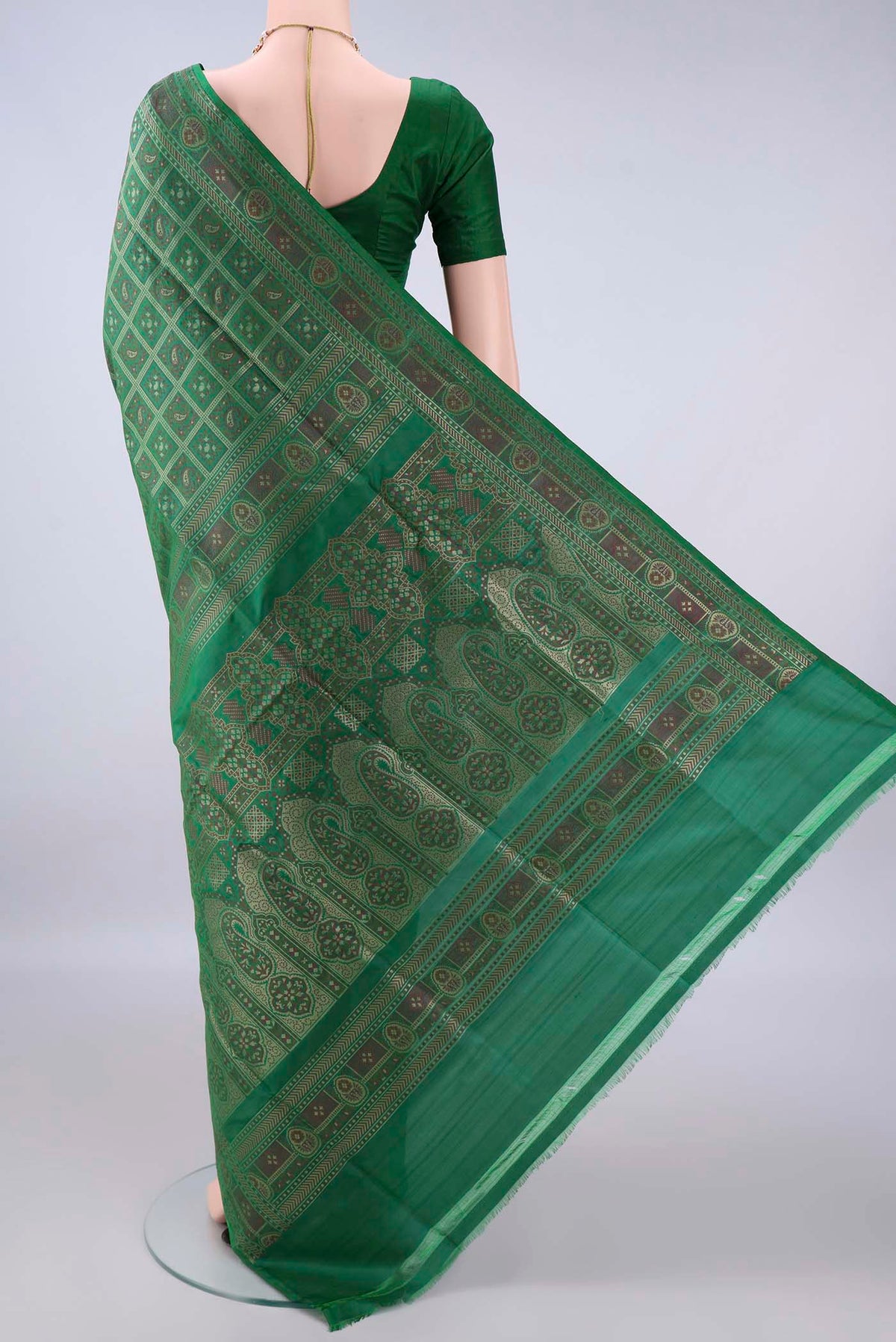 Flat view of Pure Silk Bottle Green Banarasi Jamavar Saree with Checked design on the body and Zari Border. 