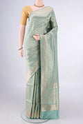 Pure Silk Light Green Banarasi Saree with Zari Brocade on the body and Zari Border.  displayed on a mannequin