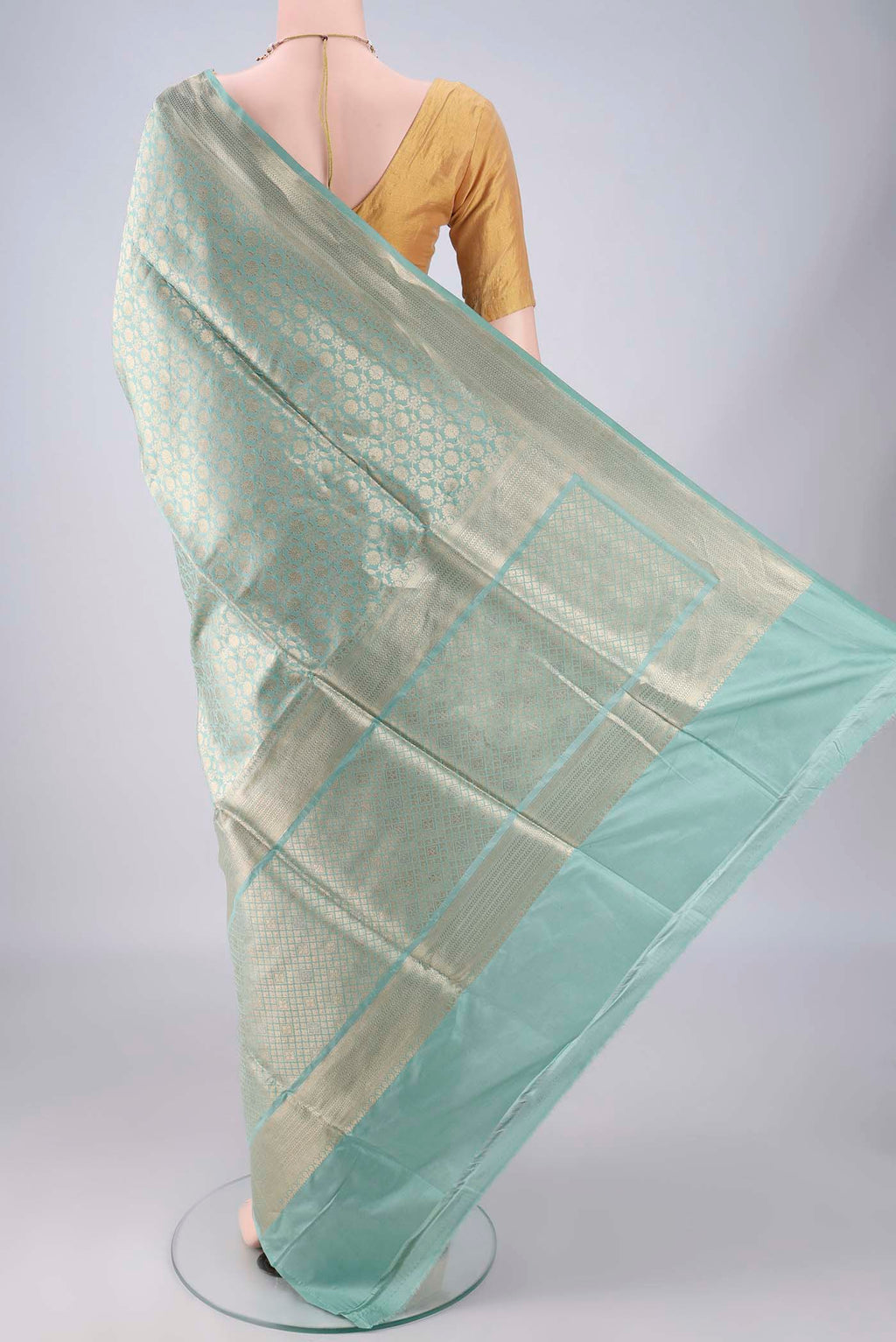 Flat view of Pure Silk Light Green Banarasi Saree with Zari Brocade on the body and Zari Border. 