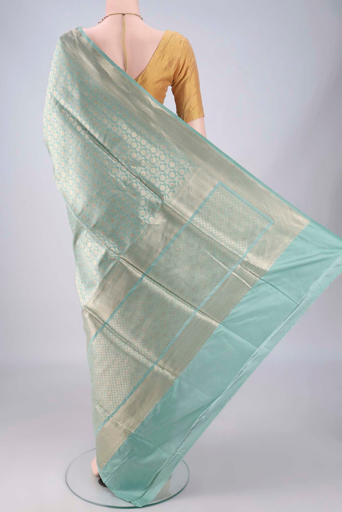 Flat view of Pure Silk Light Green Banarasi Saree with Zari Brocade on the body and Zari Border. 
