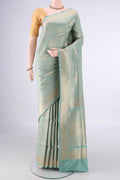 Pure Silk Light Green Banarasi Saree with Zari Brocade on the body and Zari Border.  displayed on a mannequin