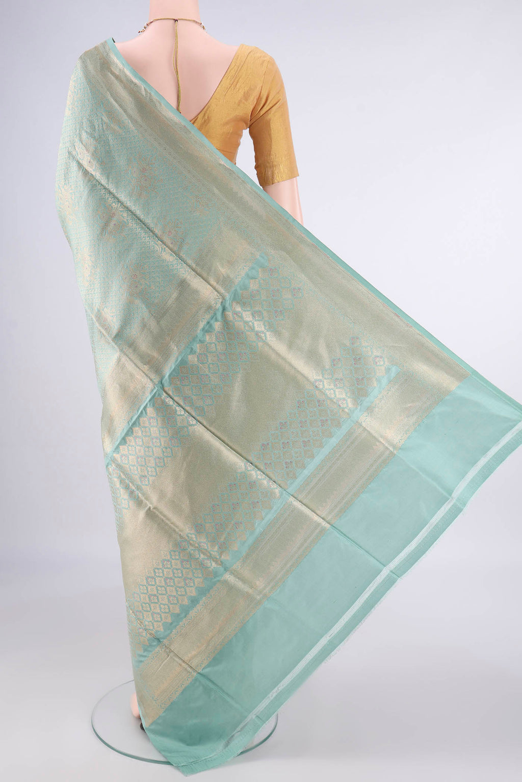 Flat view of Pure Silk Light Green Banarasi Saree with Zari Brocade on the body and Zari Border. 