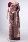 Burgundy Banarasi Saree with Zari Brocade on the body and Zari Border.  displayed on a mannequin