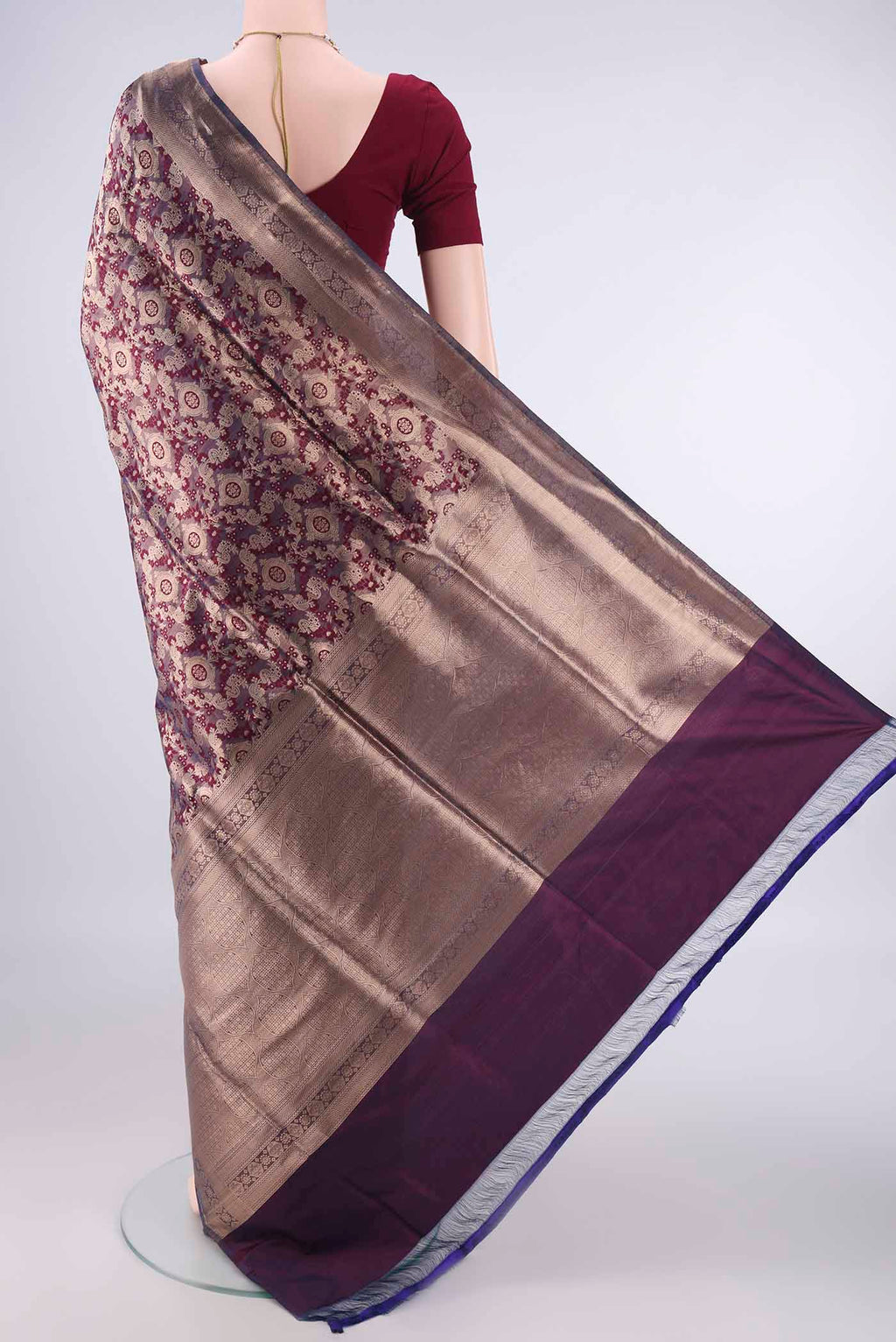 Flat view of Burgundy Banarasi Saree with Zari Brocade on the body and Zari Border. 