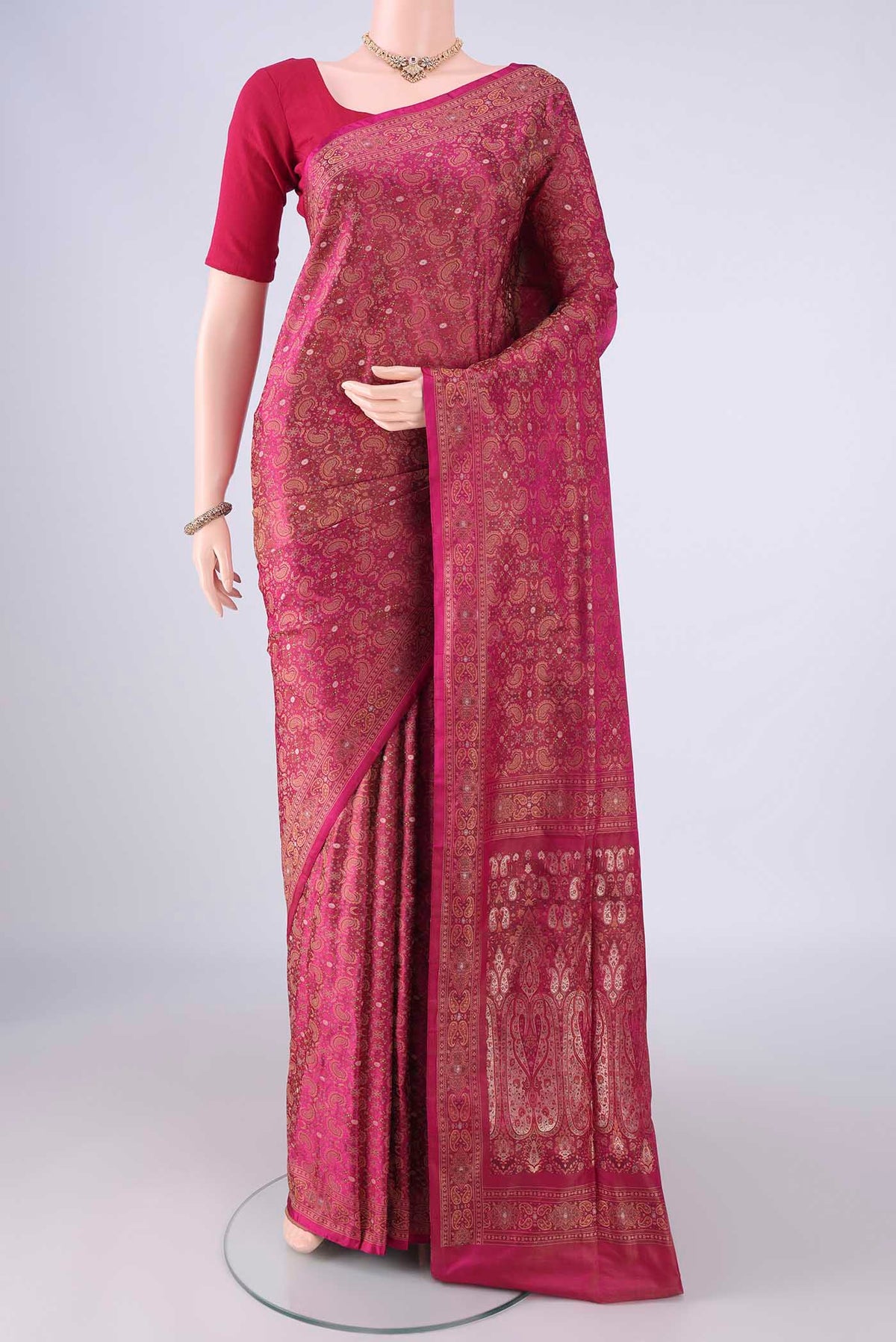 Rani Pink Banarasi Tanchoi Silk Saree with Jacquard With Thread Butta on the body and Thread Border.  displayed on a mannequin