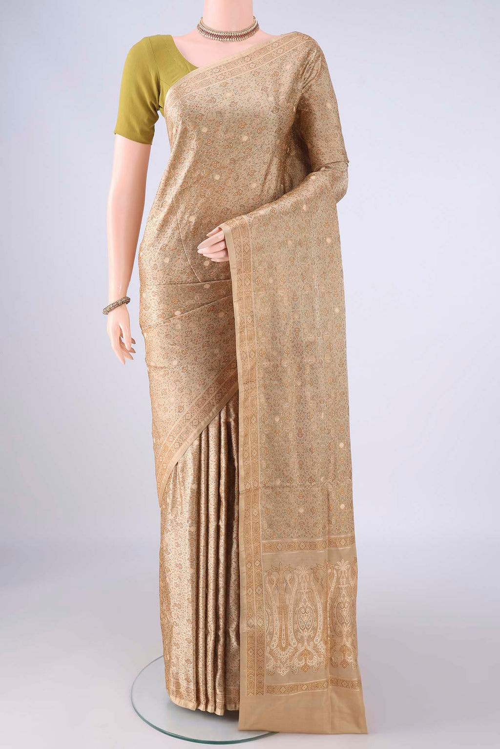 Beige Banarasi Tanchoi Silk Saree with Jacquard With Thread Butta on the body and Thread Border.  displayed on a mannequin