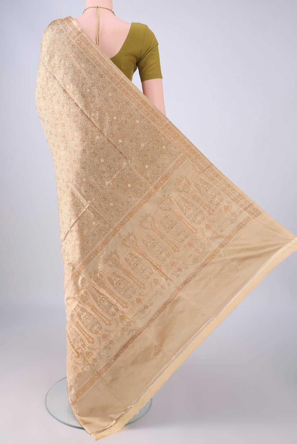 Flat view of Beige Banarasi Tanchoi Silk Saree with Jacquard With Thread Butta on the body and Thread Border. 