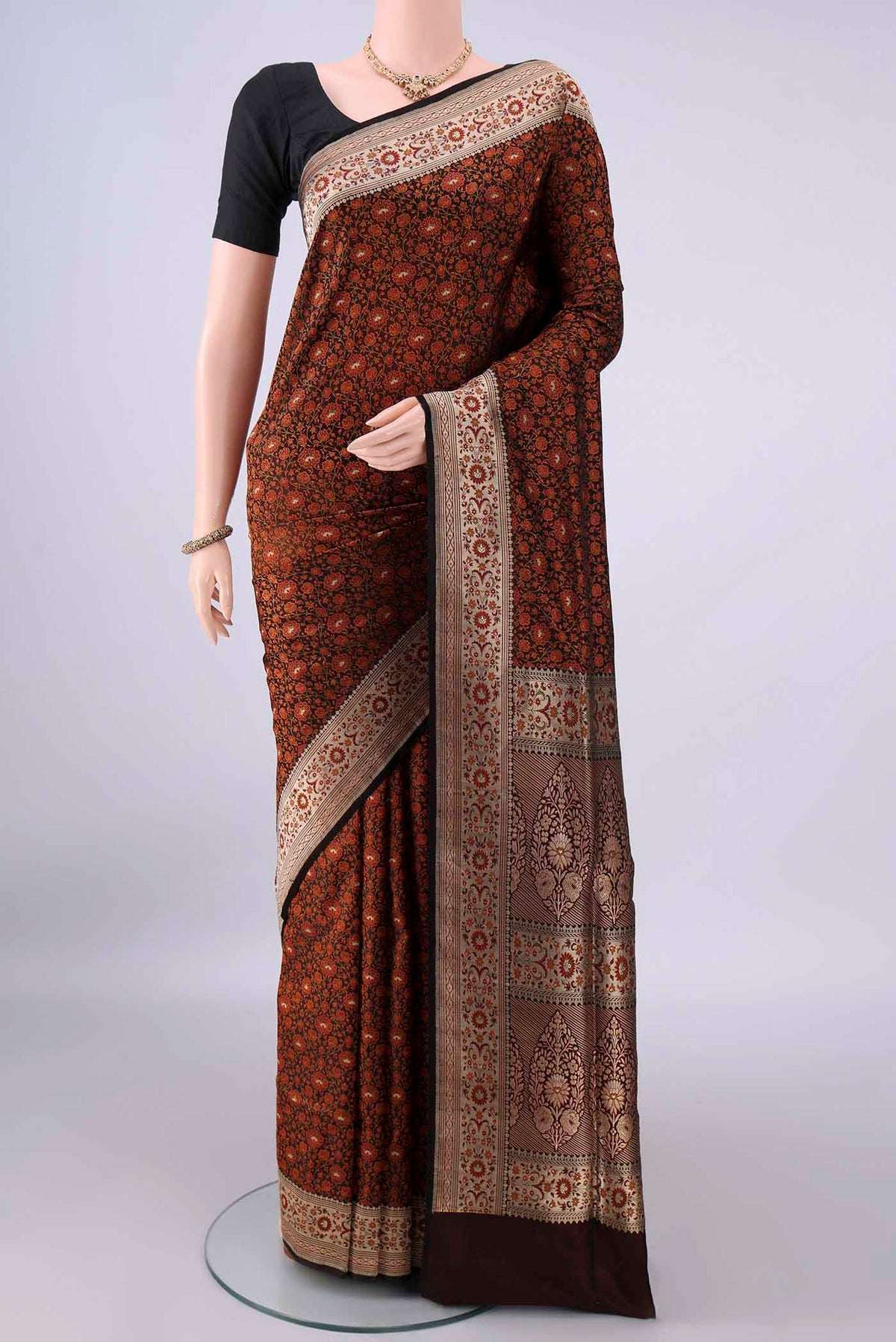 Pure Silk Black Banarasi Tanchoi Saree with Thread Brocade on the body and Zari Border.  displayed on a mannequin
