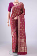 Magenta Banarasi Tanchoi Silk Saree with Jacquard With Thread Butta on the body and Zari And Thread Border.  displayed on a mannequin