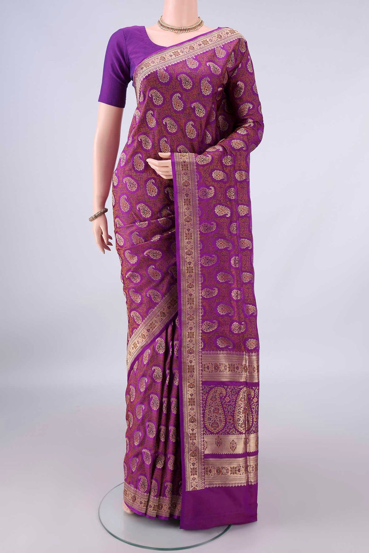 Pure Silk Purple Banarasi Tanchoi Saree with Jacquard With Zari Butta on the body and Zari Border.  displayed on a mannequin