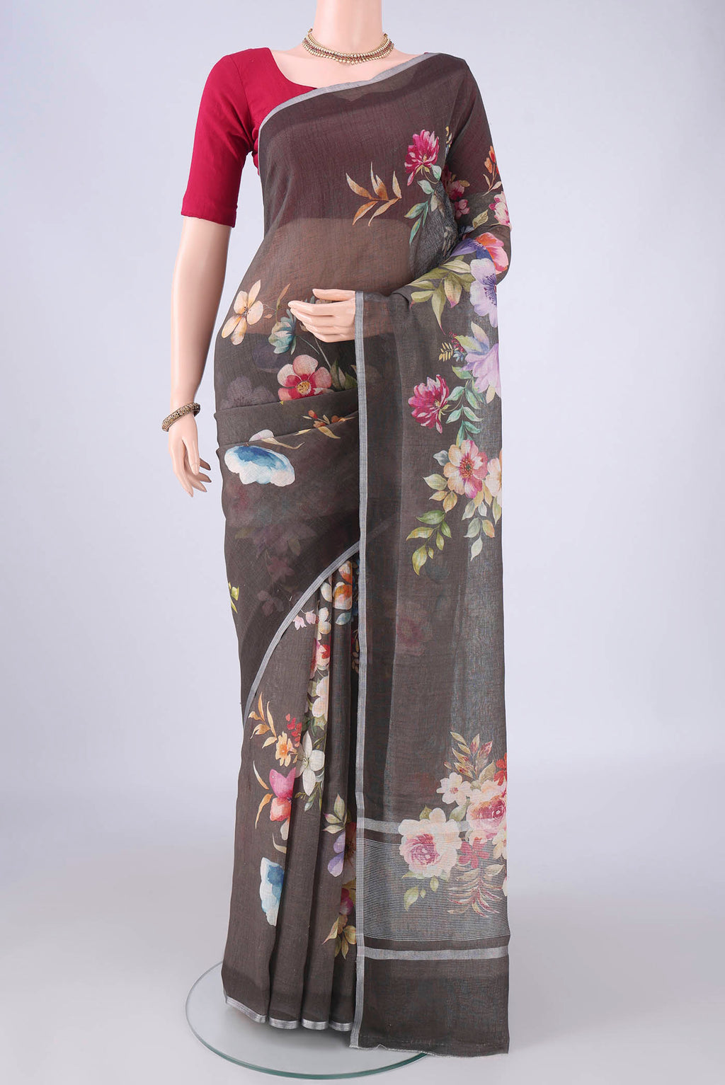 Pure Silk Davys Grey Linen Saree with Floral Print on the body and Zari Border.  displayed on a mannequin