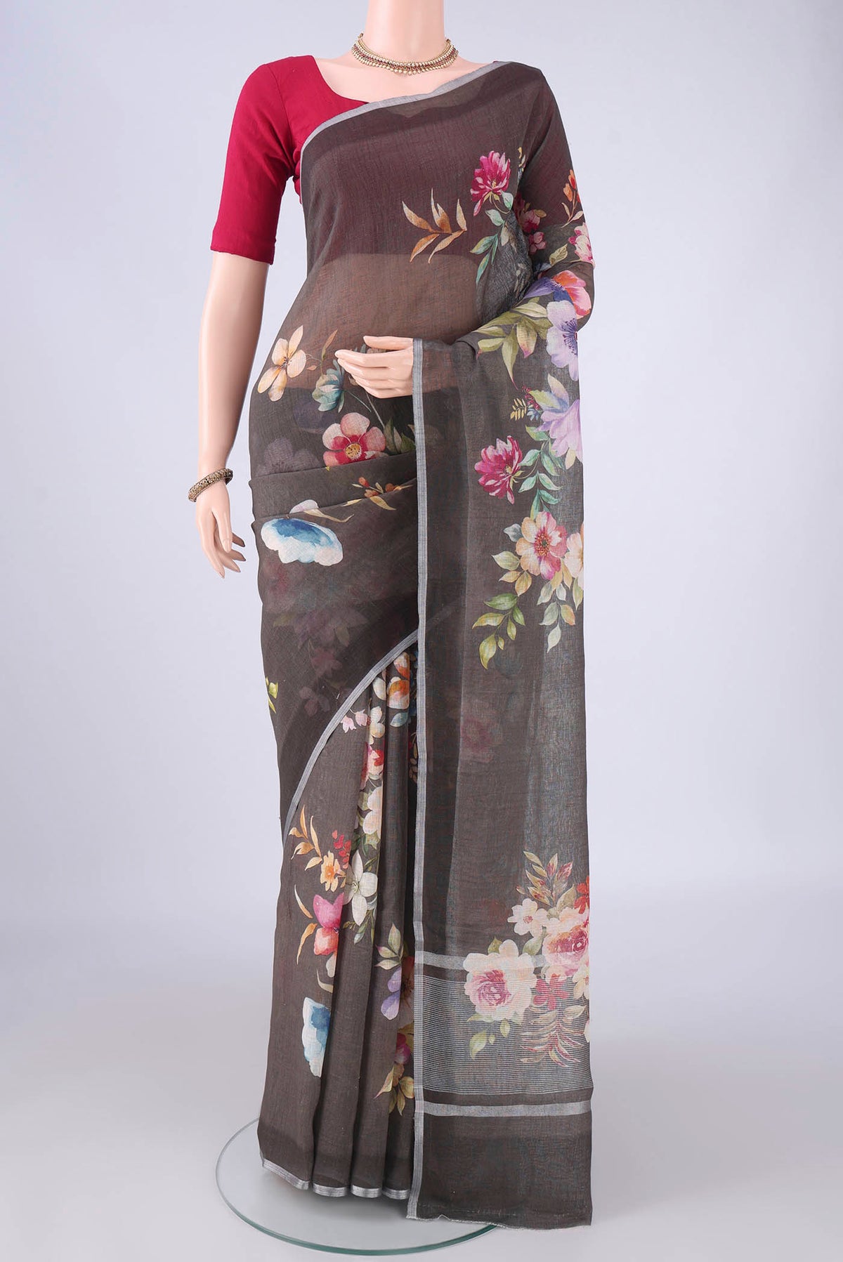 Pure Silk Davys Grey Linen Saree with Floral Print on the body and Zari Border.  displayed on a mannequin