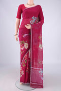 Dark Pink Linen Saree with Floral Print on the body and Zari Border.  displayed on a mannequin