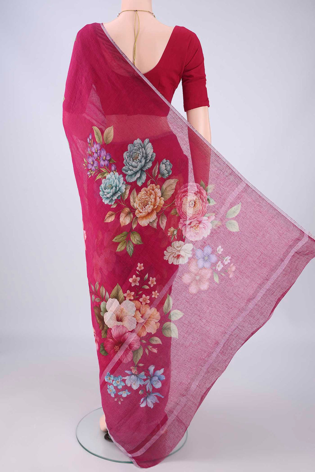 Flat view of Dark Pink Linen Saree with Floral Print on the body and Zari Border. 