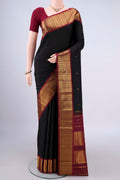Pure Silk Black Kanjivaram Saree with Zari Butta on the body and Zari Border.  displayed on a mannequin