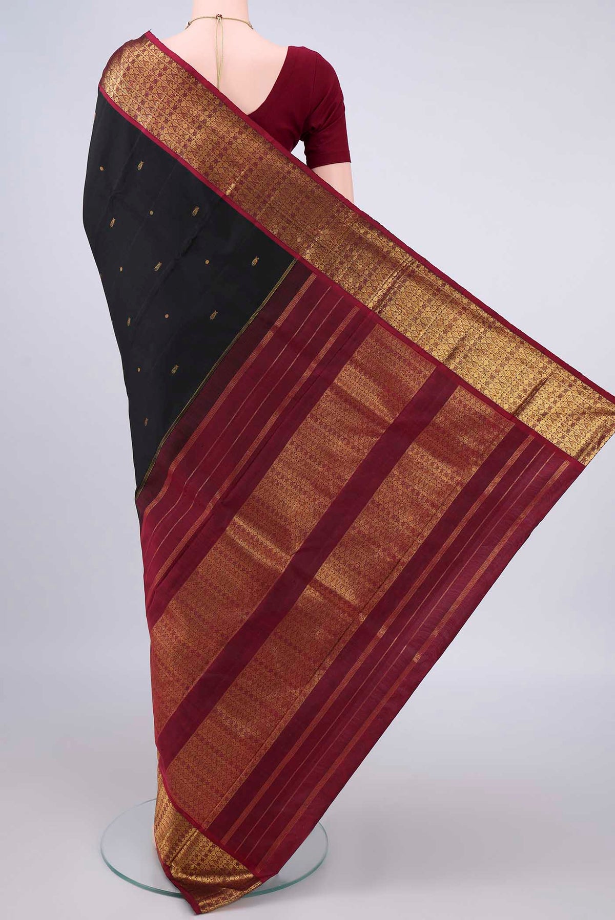 Flat view of Pure Silk Black Kanjivaram Saree with Zari Butta on the body and Zari Border. 