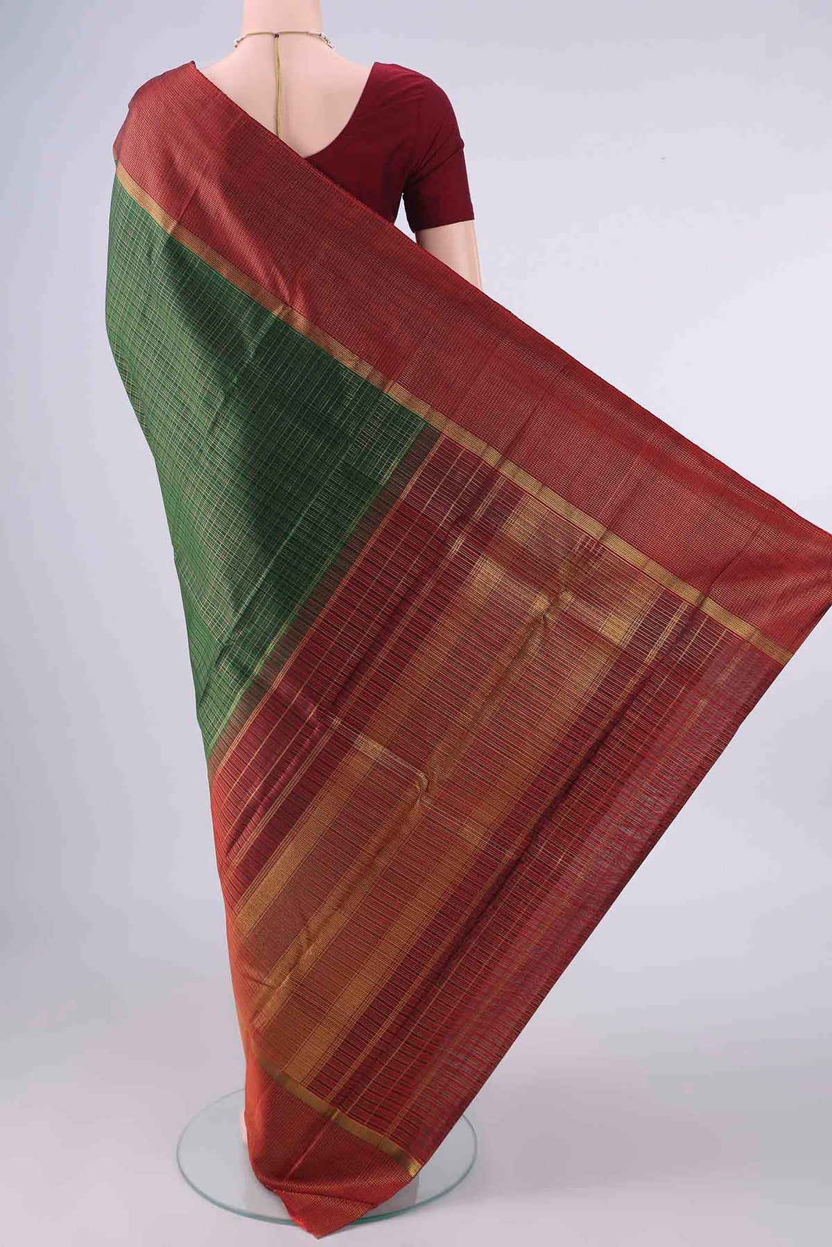 Flat view of Pure Silk Bottle Green Kanjivaram Saree with Checked design on the body and Zari Border. 