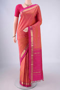Pinkish Yellow Dual Tone Kanjivaram Silk Saree with Zari Butta on the body and Zari Border.  displayed on a mannequin