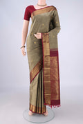Grey Kanchipuram Silk Saree with Zari Butta on the body and Zari Border.  displayed on a mannequin