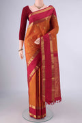 Pure Silk Mustard Kanchipuram Saree with Zari Butta on the body and Zari Border.  displayed on a mannequin