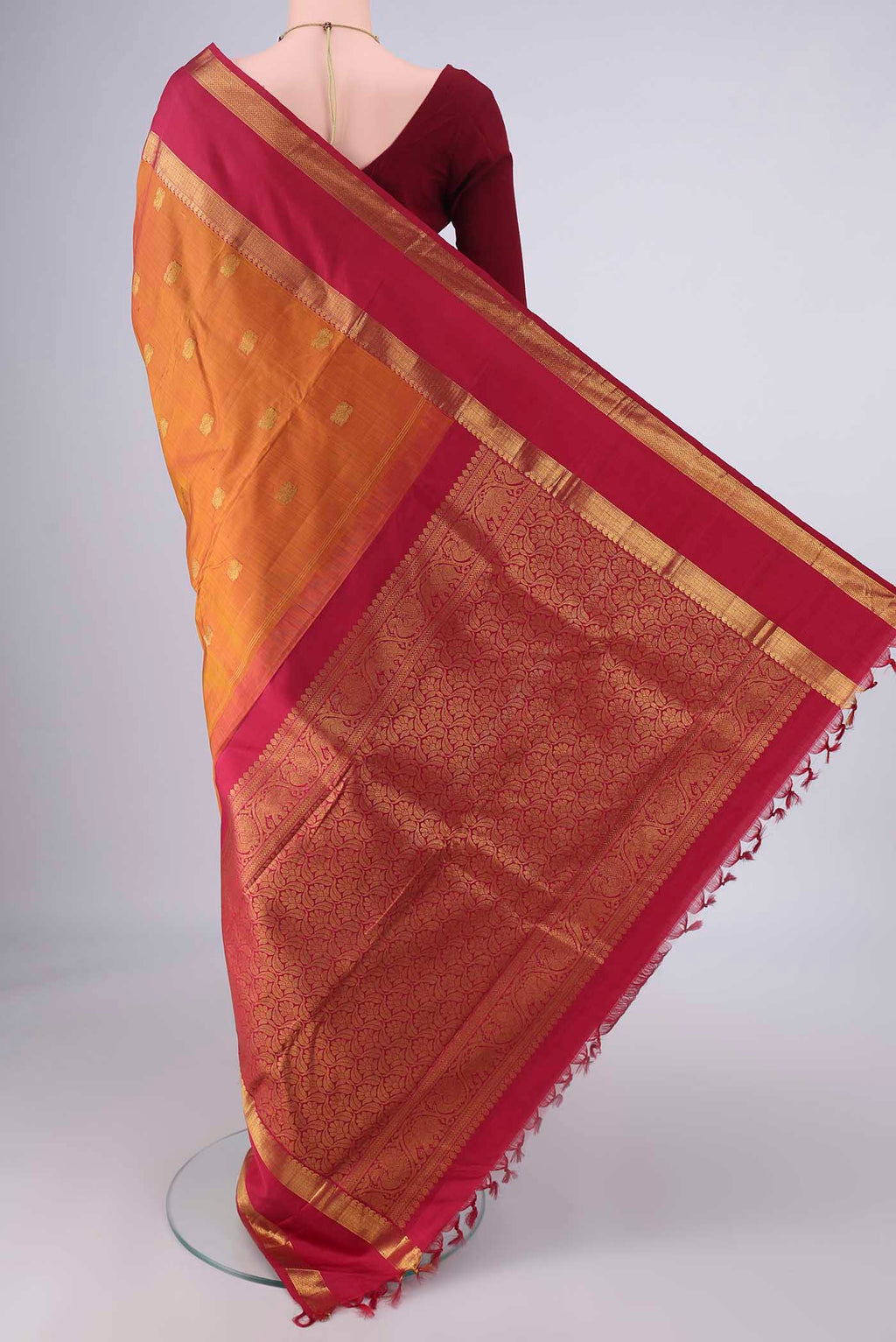 Flat view of Pure Silk Mustard Kanchipuram Saree with Zari Butta on the body and Zari Border. 