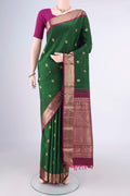 Pure Silk Bottle Green Kanchipuram Saree with Zari Butta on the body and Zari Border.  displayed on a mannequin