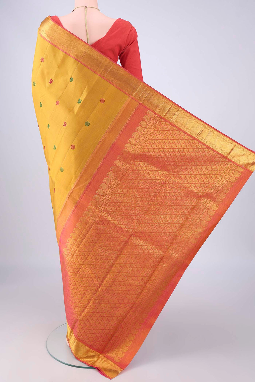 Flat view of Mustard Kanchipuram Silk Saree with Thread Butta on the body and Zari Border. 