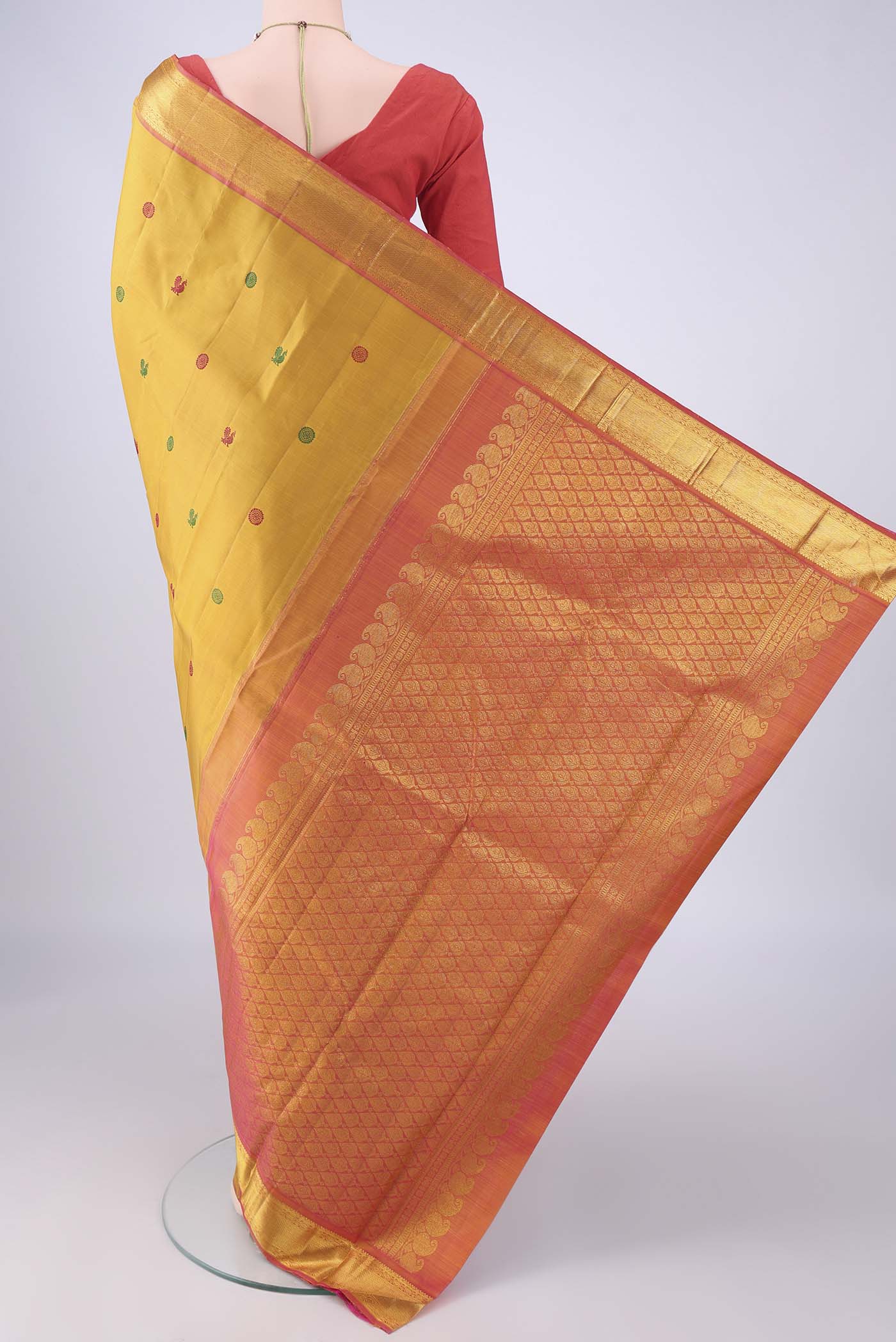 Flat view of Mustard Kanchipuram Silk Saree with Thread Butta on the body and Zari Border. 