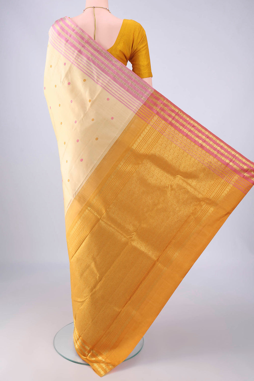 Flat view of Sandal Kanjivaram Silk Saree with Thread Butta on the body and Ganga Jamuna Border. 