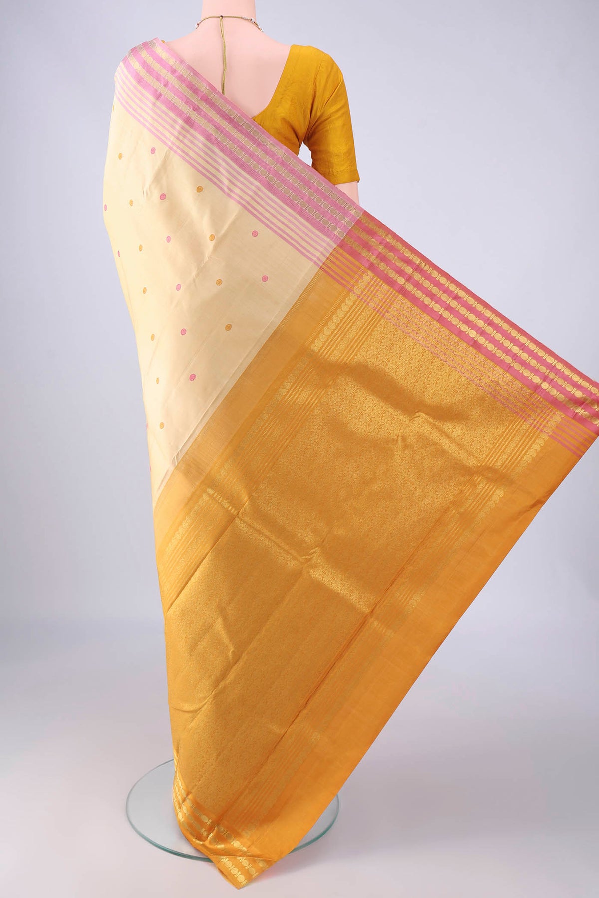 Flat view of Sandal Kanjivaram Silk Saree with Thread Butta on the body and Ganga Jamuna Border. 