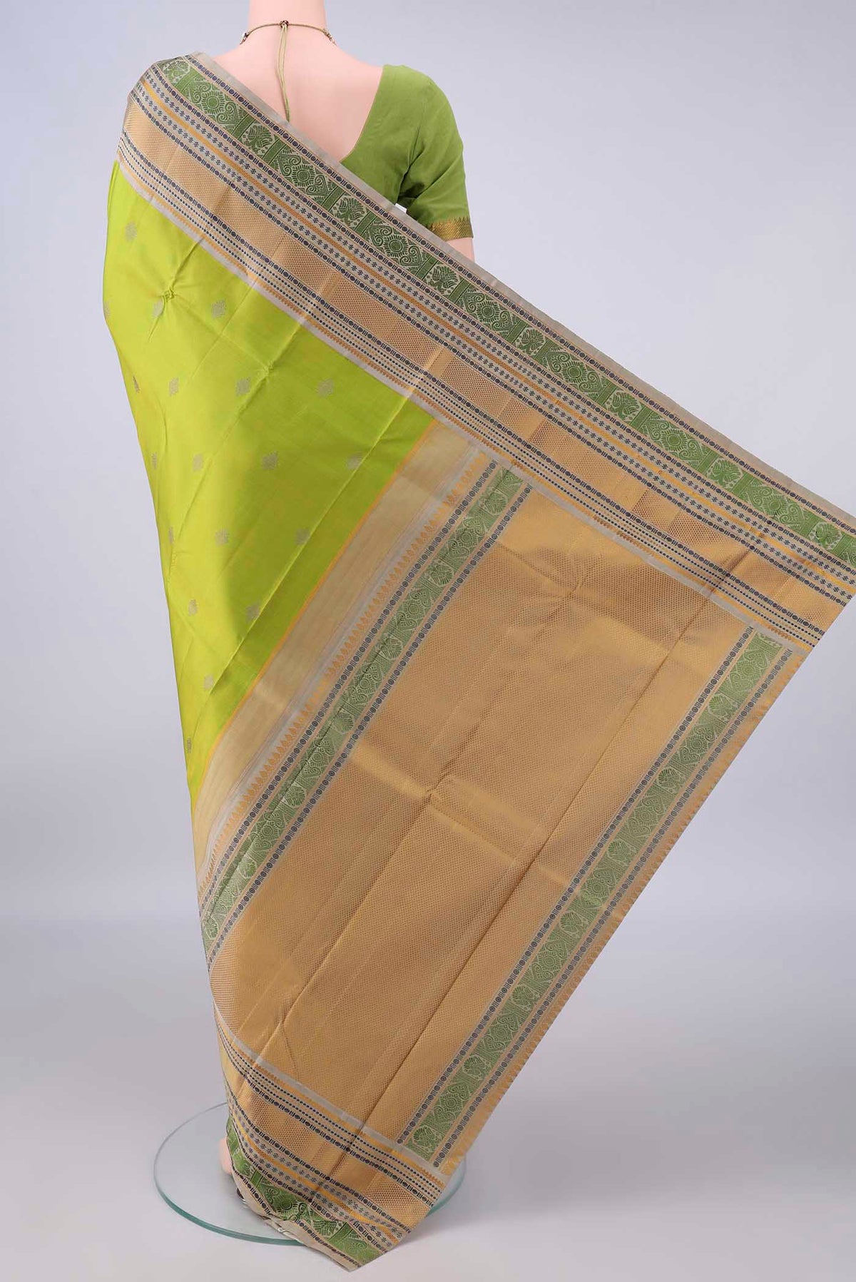 Flat view of Pure Silk Light Green Kanjivaram Saree with Thread Butta on the body and Thread Border. 