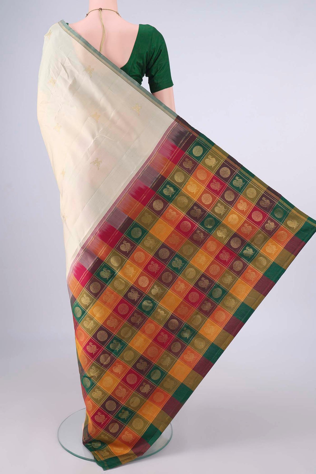 Flat view of Pure Silk Cream Kanjivaram Saree with Zari Butta on the body and Zari Border. 