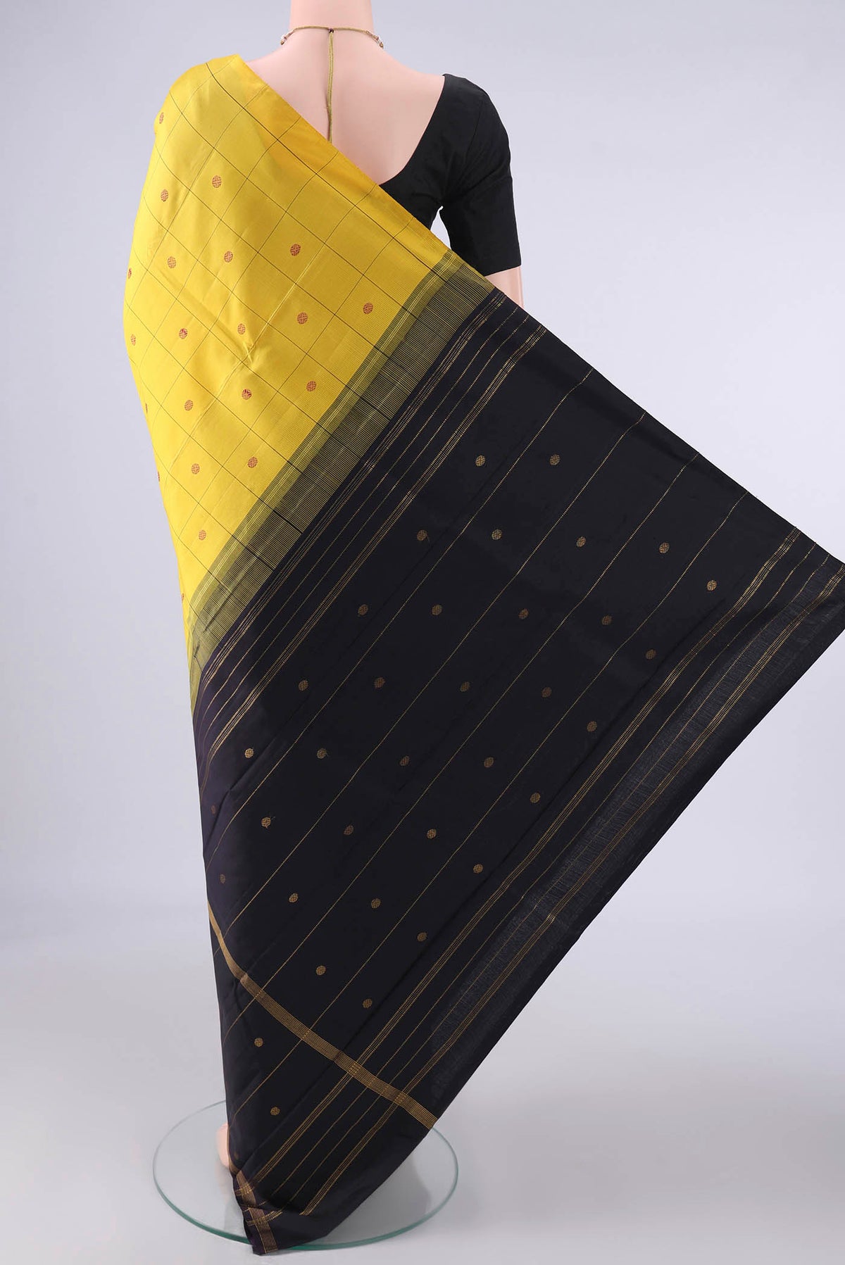 Flat view of Pure Silk Yellow Kanjivaram Saree with Checked design on the body and One Side Border. 