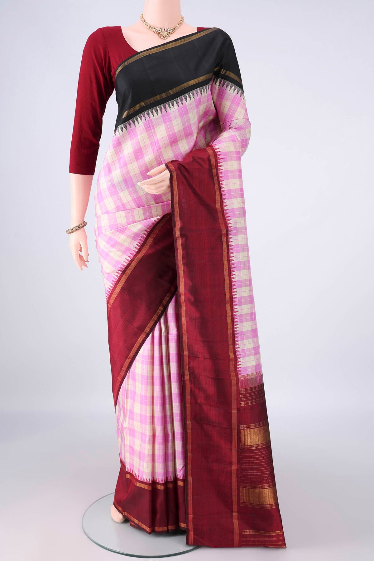 Pure Silk Rose pink Kanjivaram Saree with Checked design on the body and Ganga Jamuna Border.  displayed on a mannequin
