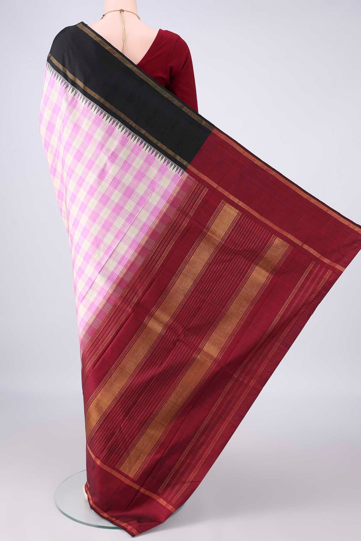 Flat view of Pure Silk Rose pink Kanjivaram Saree with Checked design on the body and Ganga Jamuna Border. 