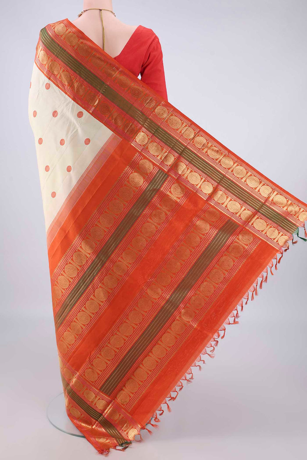 Flat view of Pure Silk Cream Kanjivaram Saree with Thread Butta on the body and Zari Border. 