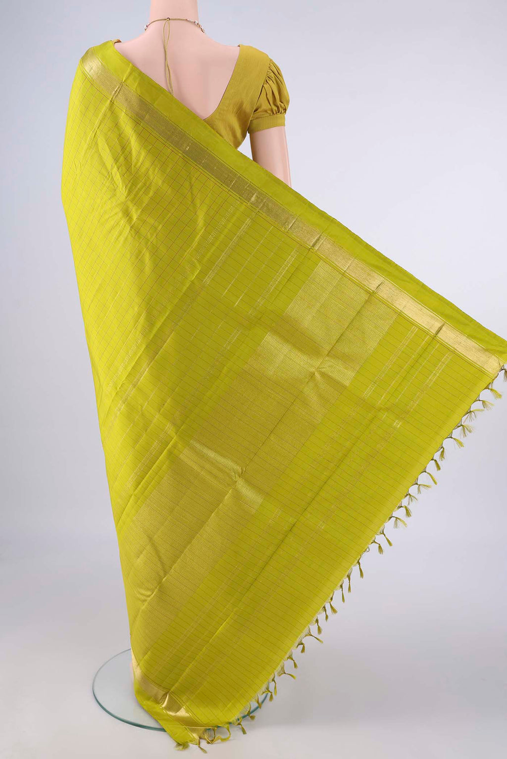Flat view of Pure Silk Green Kanjivaram Saree with Checked design on the body and Zari Border. 