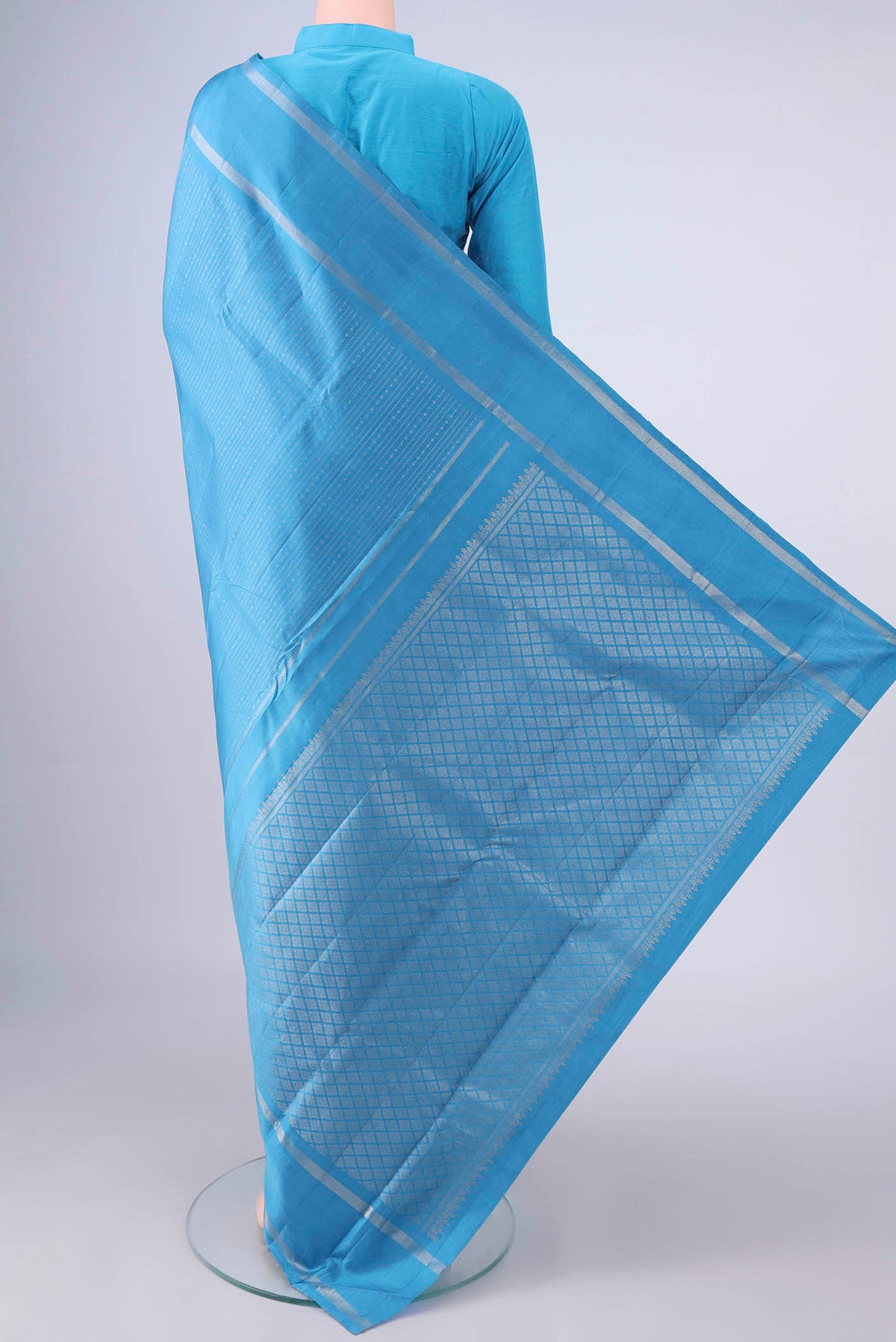 Flat view of Pure Silk Blue Kanchipuram Saree with Stripes on the body and Zari Border. 