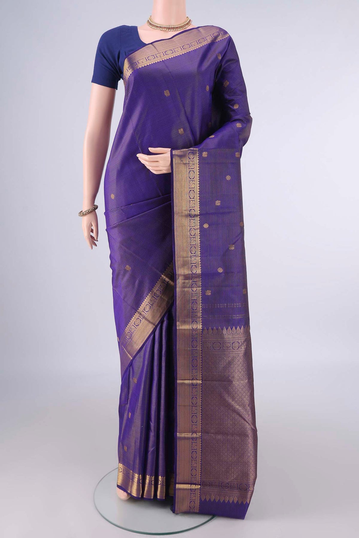 Pure Silk Royal Blue Dual Tone Kanjivaram Saree with Zari Butta on the body and Zari Border.  displayed on a mannequin